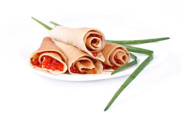 pancakes with caviar on white, close-up