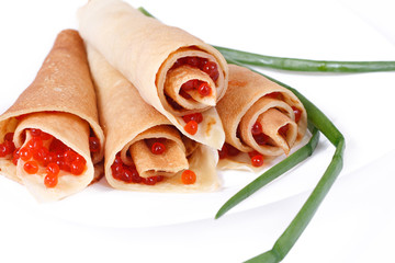 pancakes with caviar on white, close-up