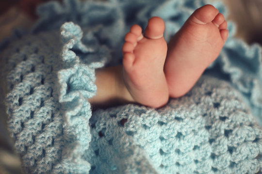 Photo Of Cute Baby Feets In Cozy Knitted Blanket