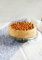 Cake with mousse, caramelized apples, hazelnut in caramel