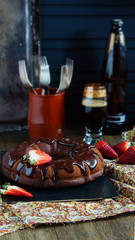 chocolate cake on the base of dark beer with strawberries
