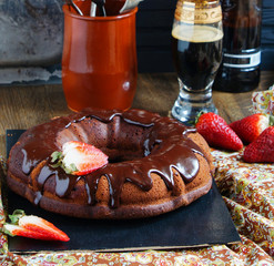 chocolate cake on the base of dark beer with strawberries