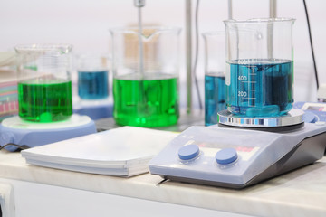Laboratory equipment. Blue chemical substance in the beaker