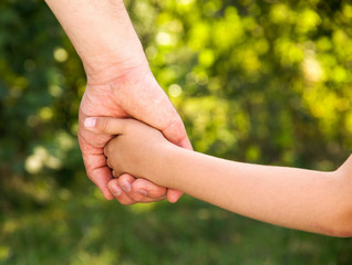 father holding  daughter hand
