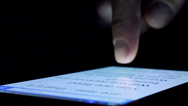 Man Using a Smart-phone at dark