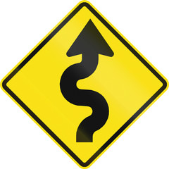 Warning road sign in Chile: Series of curves first to right ahead