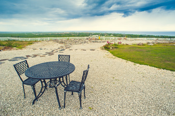 Fototapeta premium Table setting in tropical Outdoor restaurant at the beach. Cafe