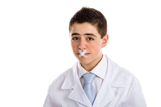 Band aids close the mouth of a boy doctor
