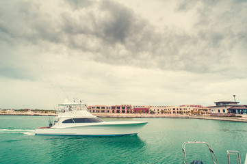 Beautiful view of luxurious white yacht moored at sea bay