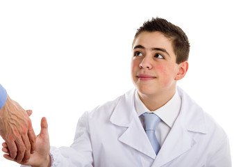 boy doctor smiling while shaking hand