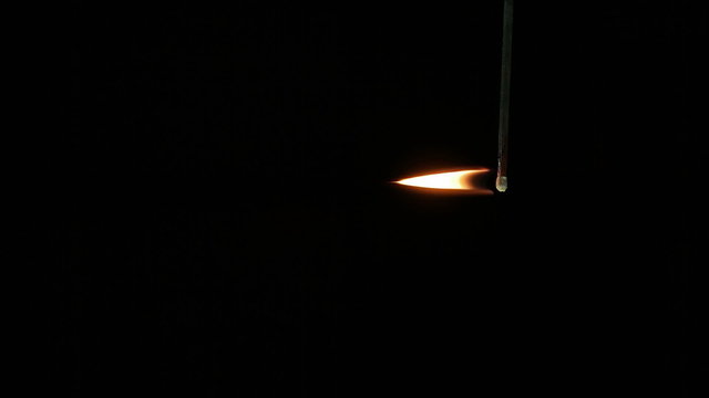 Black match stick set alight slow motion 120 fps