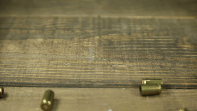 9mm bullet casings falling onto wooden floor