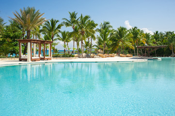 Fototapeta na wymiar Outdoor Swimming pool of luxury hotel resort near the sea