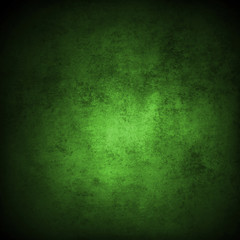 Obraz na płótnie Canvas Green textured concrete wall background. Dark edges