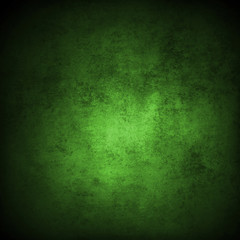 Green textured concrete wall background. Dark edges