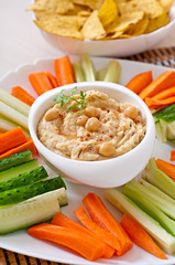 Healthy homemade hummus with vegetables, olive oil and pita chip
