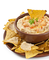 Healthy homemade hummus with olive oil and pita chips isolated 