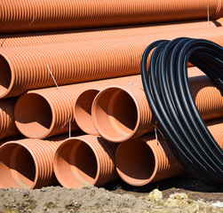 Plastic pipes and cable construction materials