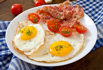 English breakfast - toast, egg, bacon and vegetables