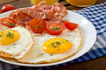 English breakfast - toast, egg, bacon and vegetables