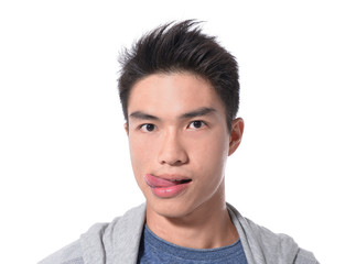 young man showing tongue, face expression 