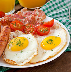 English breakfast - toast, egg, bacon and vegetables