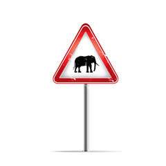 silhouettes of African elephants on warning trafic sign