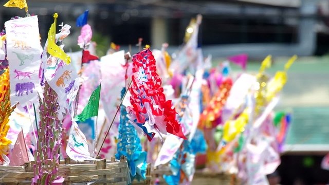 Tung Lanna flags into the sand pile for songkran festival day