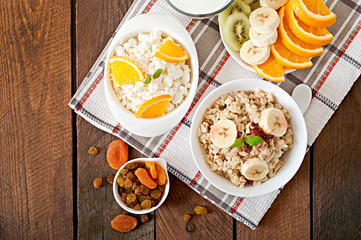 Healthy breakfast - oatmeal, cottage cheese, milk and fruit