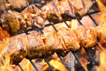 Delicious meat skewer on grill