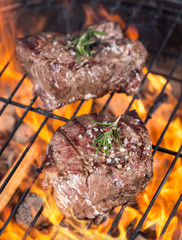 Beef steaks on grill
