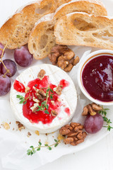 camembert with berry jam and toasts, vertical, top view