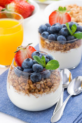 dessert with cream, fresh berries and granola, top view
