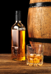 Whiskey and oak barrel