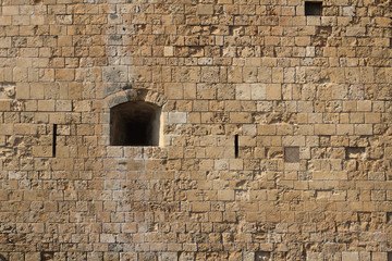 Loophole in castle close-up. Cyprus Paphos
