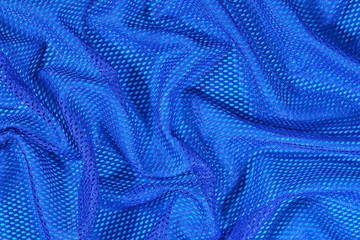 Fototapeta na wymiar Blue crumpled nonwoven fabric background