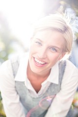 Pretty blonde woman smiling at the camera