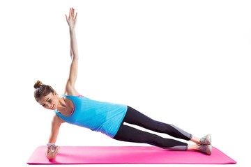 Fit woman doing side plank