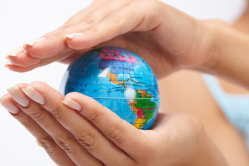 woman's hand with globe