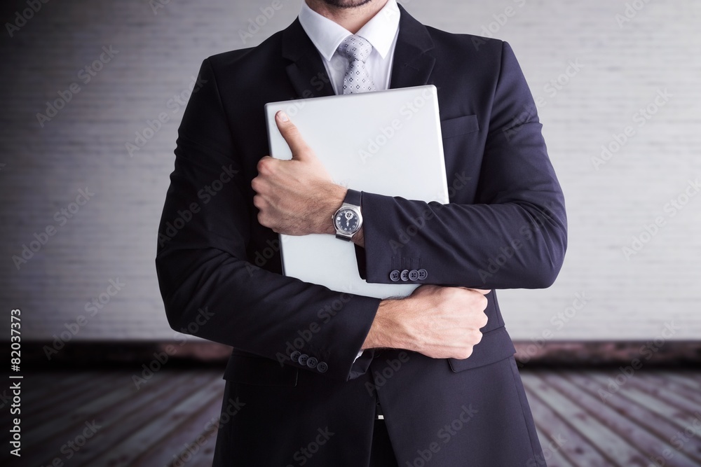 Poster composite image of mid section of businessman holding computer