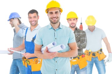 Composite image of happy male architect holding blueprints