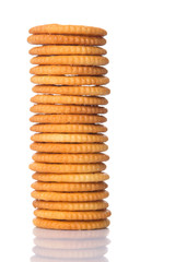 Round salted cracker over white background