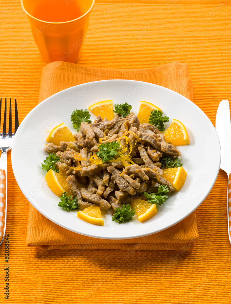 Wall mural meat stew with orange sauce and orange peel