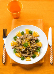 meat stew with orange sauce and orange peel