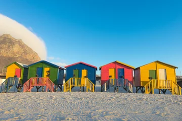Poster Sunrise at the famous colorful beach huts at Muizenberg Beach © Allen.G