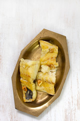 fried codfish on dish on white background