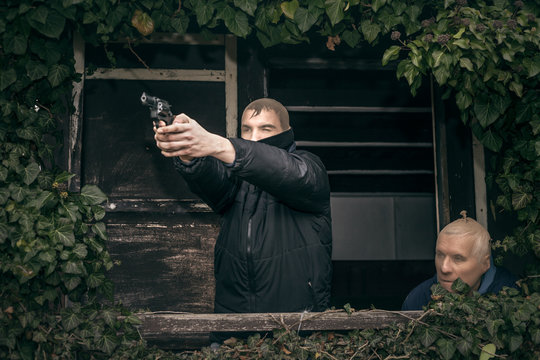 Masked men with a gun