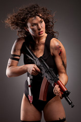 Beautiful woman with gun ak 47