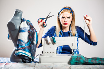 Worker on sewing machine is angry - obrazy, fototapety, plakaty