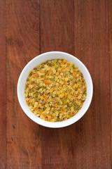 pasta stars in white bowl on brown background